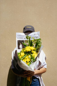 Flinders student holding floral bouquet 